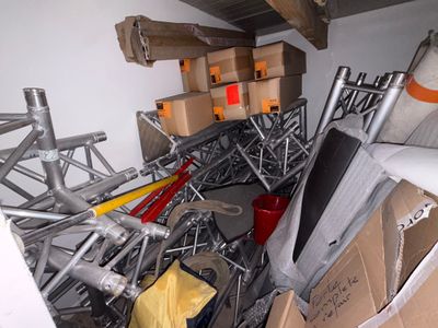 a pile of boxes and other items in a room