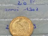 a close up of a gold coin on a plastic bag