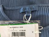 a close up of a blue sweater with a price tag on it