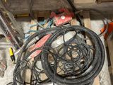 a pile of wires and tools on the floor