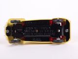a yellow skateboard with black wheels on a white surface