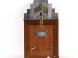 a clock that is sitting on top of a wooden stand
