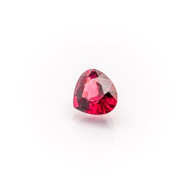 a heart shaped pink tourmaline gems on a white background
