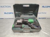 a tool in a case that is sitting on top of a table