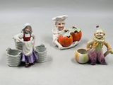 trois figurines représentant une femme, un homme et un enfant