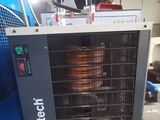 a picture of a refrigerated air conditioner in a garage