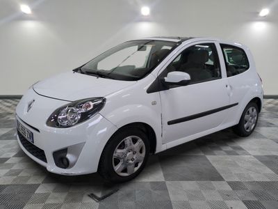 a picture of a small white car parked on a checkered floor