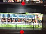 a book shelf with many dvds on it