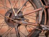 a close up of a bike wheel with a chain attached to it