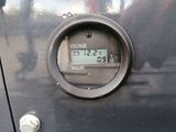 a close up of a digital meter on a car ' s dashboard