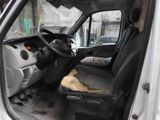 a white van with a black seat and steering wheel