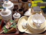 a tray that has a lot of dishes and cups on it