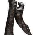 bronze sculpture of a dog and a cat on a wooden base