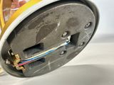 a person that is holding a clock with wires in it