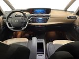 a picture of the interior of a car with a steering wheel and dashboard