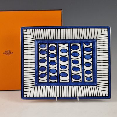 an image of a blue and white plate with a box in the background
