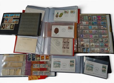 a lot of stamps and envelopes sitting on a table