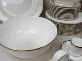 a lot of plates and cups on the table