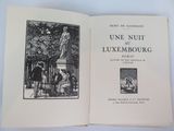 an open book with a picture of a man and a woman sitting on a bench