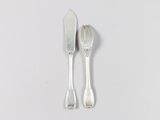 two spoons and a fork on a white surface