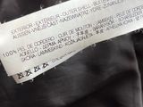 a close up of a label on a black jacket