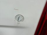 a white car with a clock on the side of it