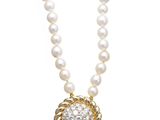a necklace with pearls and diamonds on a white background