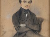 portrait of a man in a suit with his arms crossed