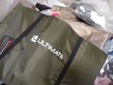 a large bag of stuff sitting on top of a pile of bags