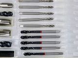 many different types of screws in a plastic box