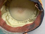 a close up of a hat on a table