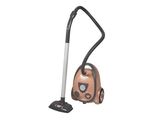 un aspirateur marron et noir posé sur un sol blanc