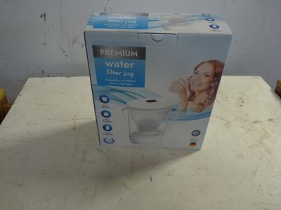 packaging of a water purifier sitting on top of a table