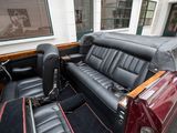 a red car with black leather seats in the back of it