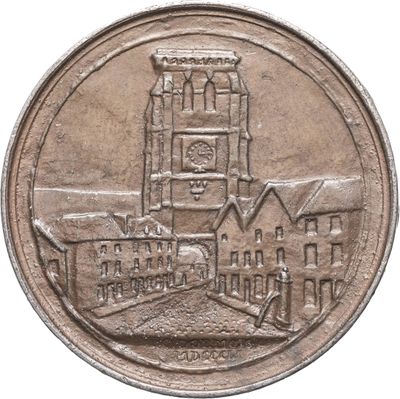 une vieille pièce de monnaie sur laquelle figure l'image d'une église