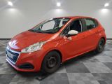 a red car is parked in a room with a checkered floor