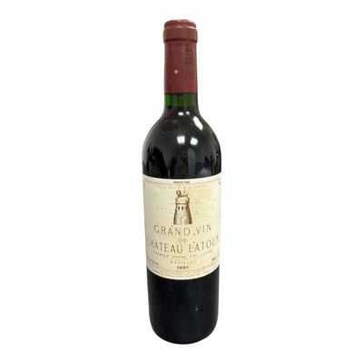 a bottle of wine that is sitting on a table