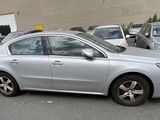 a silver car that is parked in a parking lot