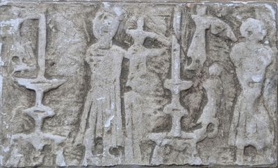 relief of a man and a woman with a cat and a dog