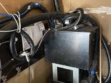 a room with a lot of wires and a lot of boxes
