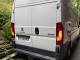 a white van that is parked on the side of the road