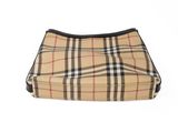 the small vintage check bag is on a white surface