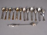 several spoons and spoon spoons are lined up on a table