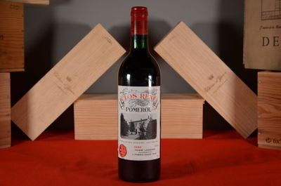 a bottle of wine that is sitting on a table