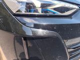 a close up of a car ' s headlight and front bumper