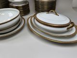a lot of plates and bowls on the table