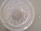 a plastic cup that is sitting on top of a table