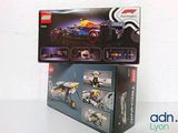 two boxes of legos sitting on top of each other