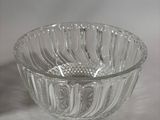 a glass bowl that is sitting on a table