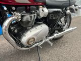 a close up of a motorcycle parked in a parking lot